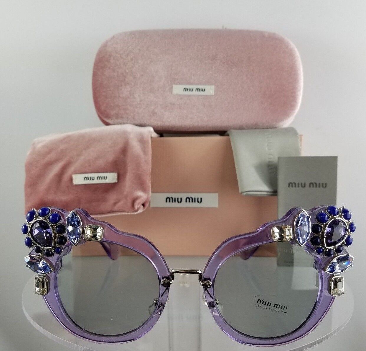 Brand New Authentic MIU MIU SMU 04S U69-5J0 Sunglasses Transparent Lilac Crystal