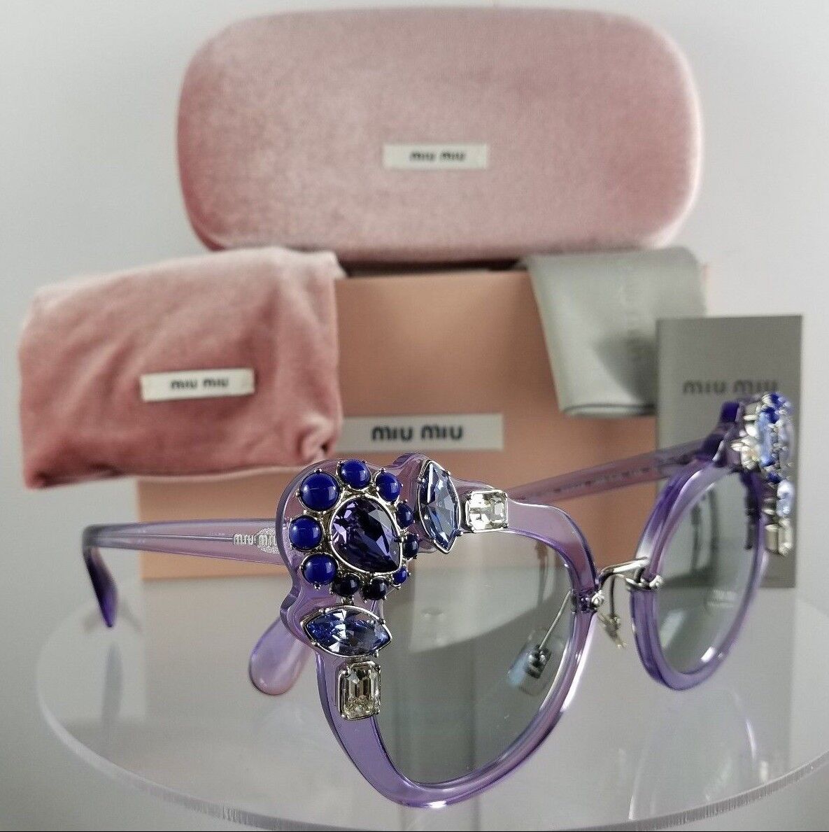 Brand New Authentic MIU MIU SMU 04S U69-5J0 Sunglasses Transparent Lilac Crystal