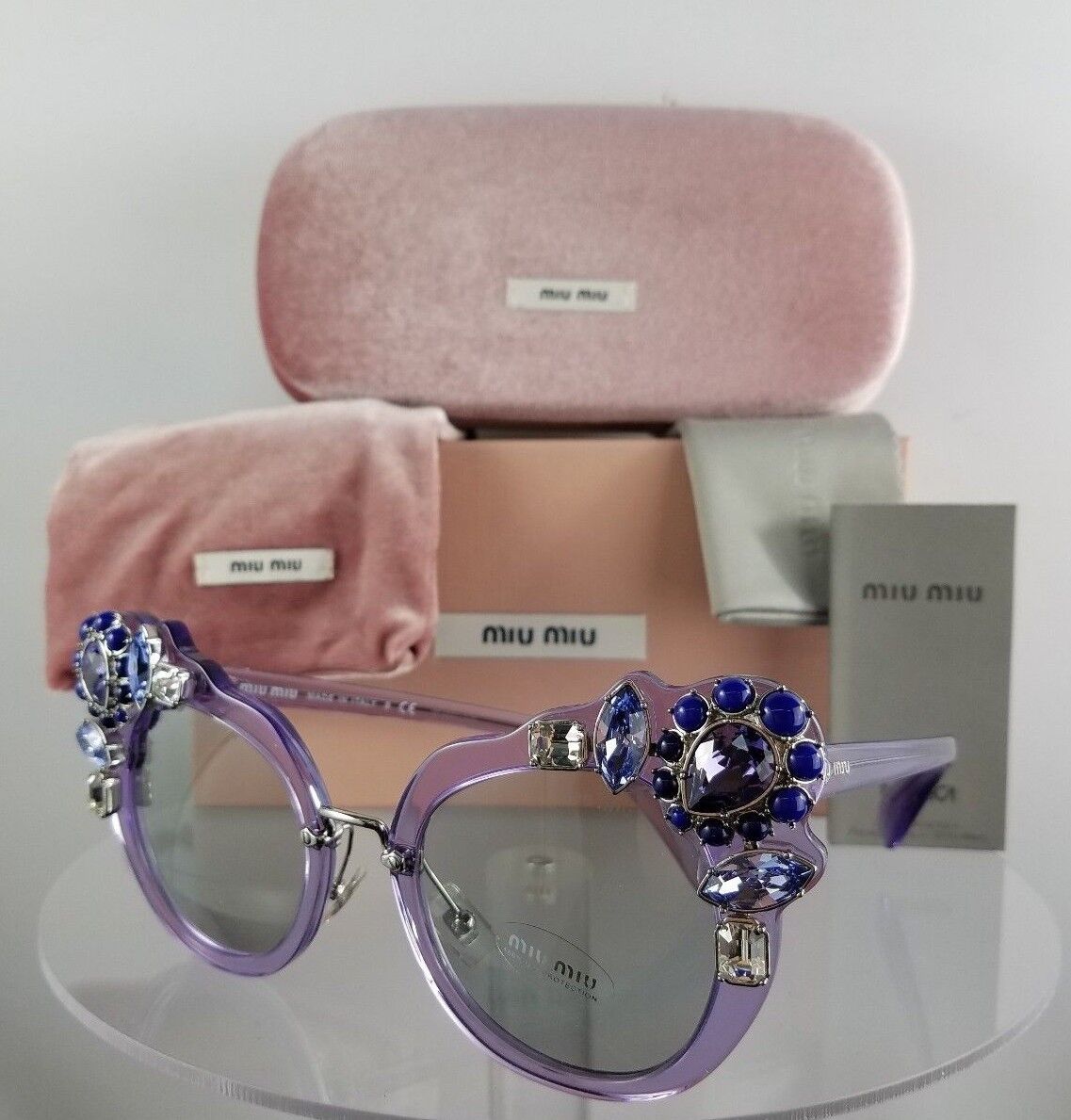 Brand New Authentic MIU MIU SMU 04S U69-5J0 Sunglasses Transparent Lilac Crystal