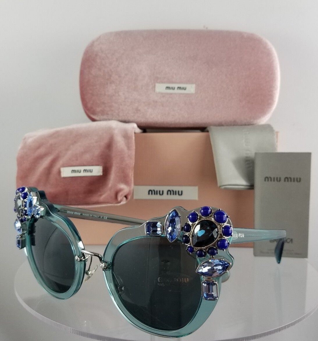 Brand New Authentic MIU MIU SMU 04S VAA-1A1 Sunglasses Transparent Green Azure